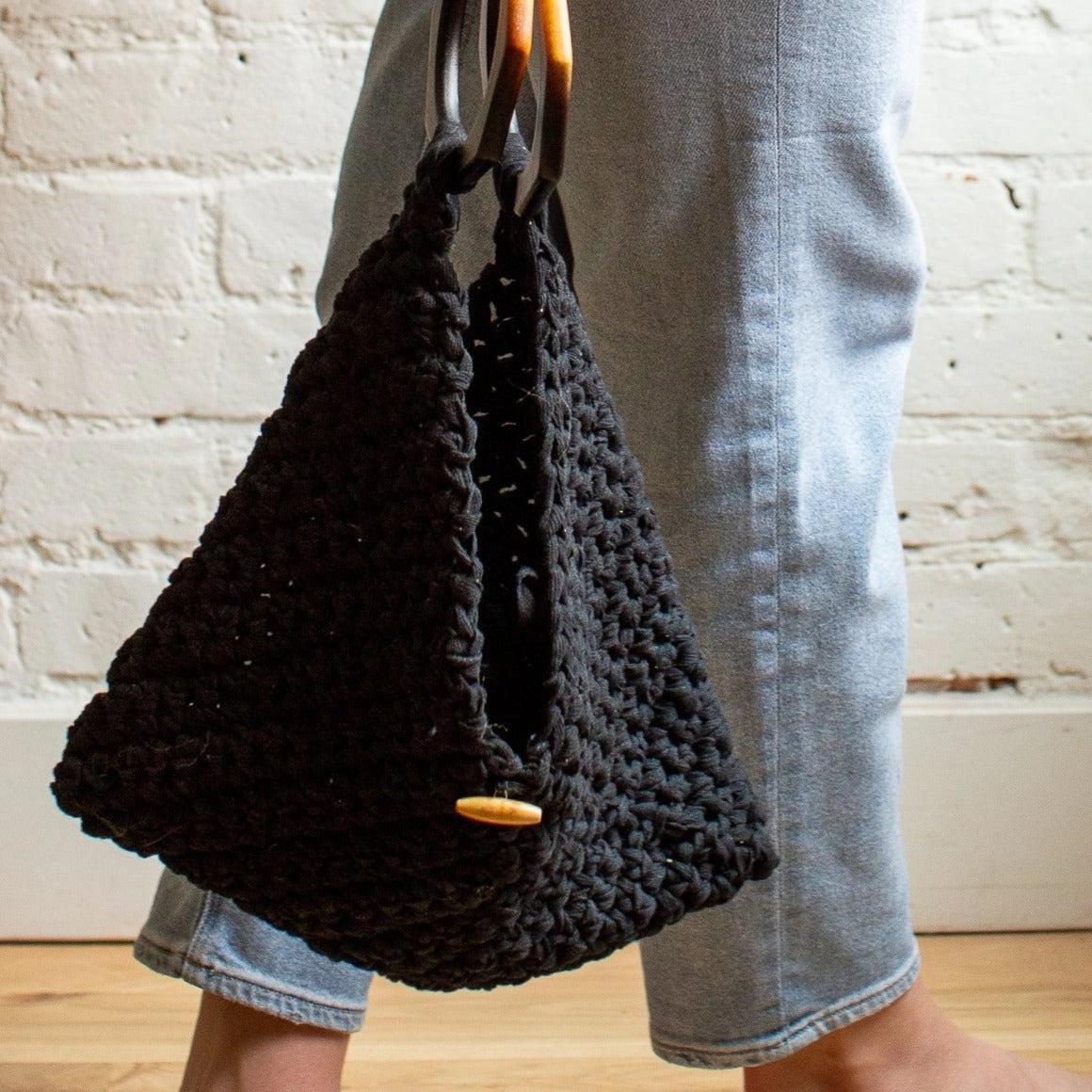 Handmade knitted black purse with wooden handles