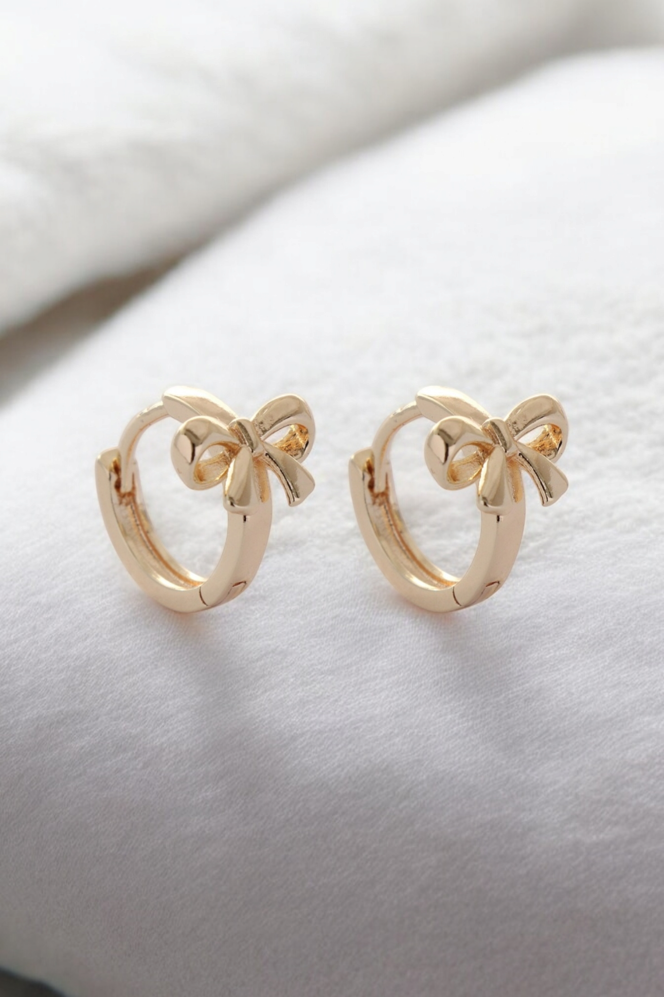 Bow huggie hoops