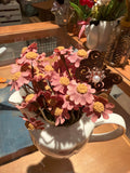 Decorative Pink Floral Arrangement in White Ceramic Pitcher with Butterfly Accent