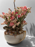Pink flowers in white/gold creamer arrangement - green doily
