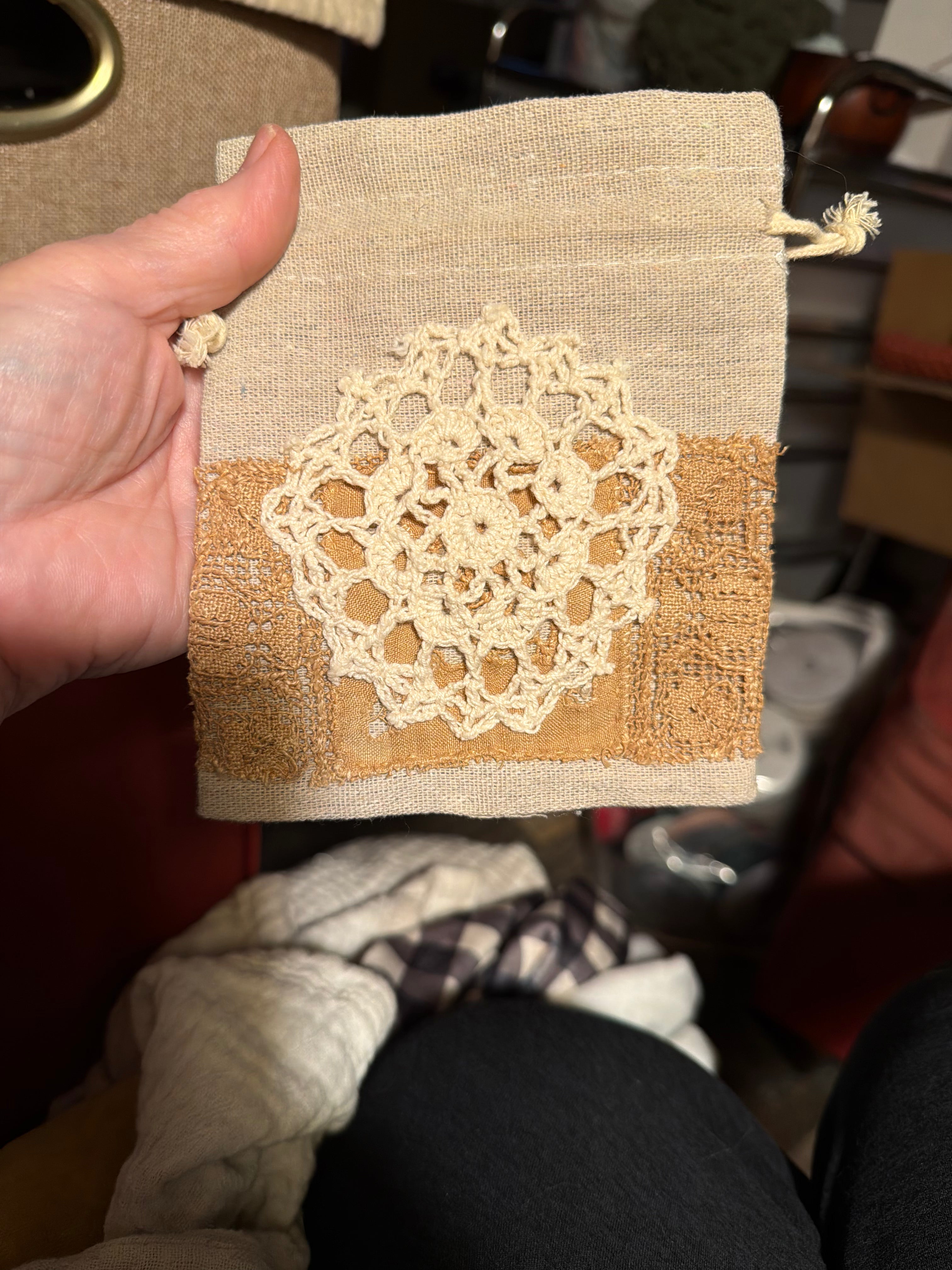 Small linen drawstring bag with hand sewn doily decor