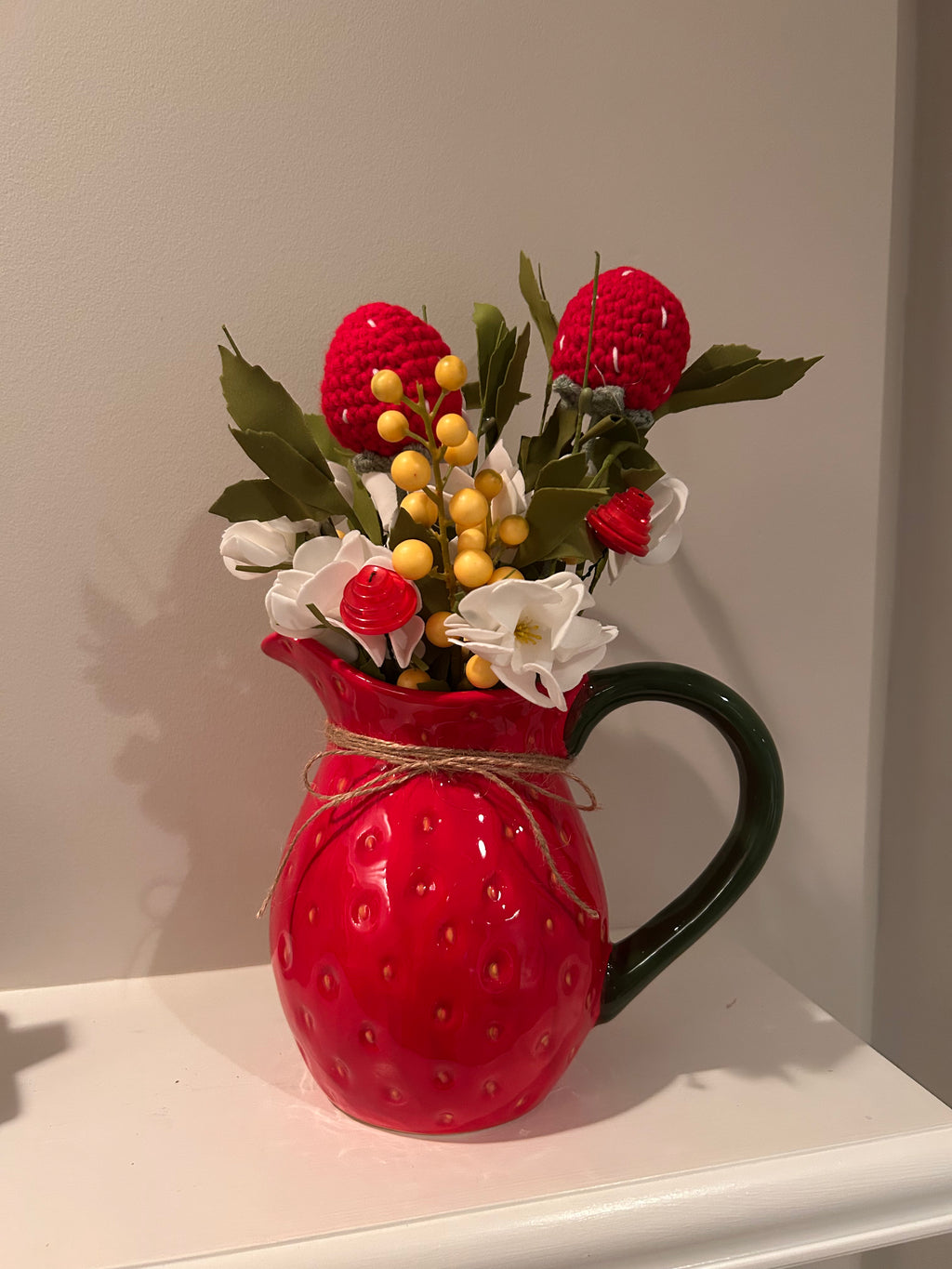Strawberry pitcher arrangement with hand crocheted strawberries