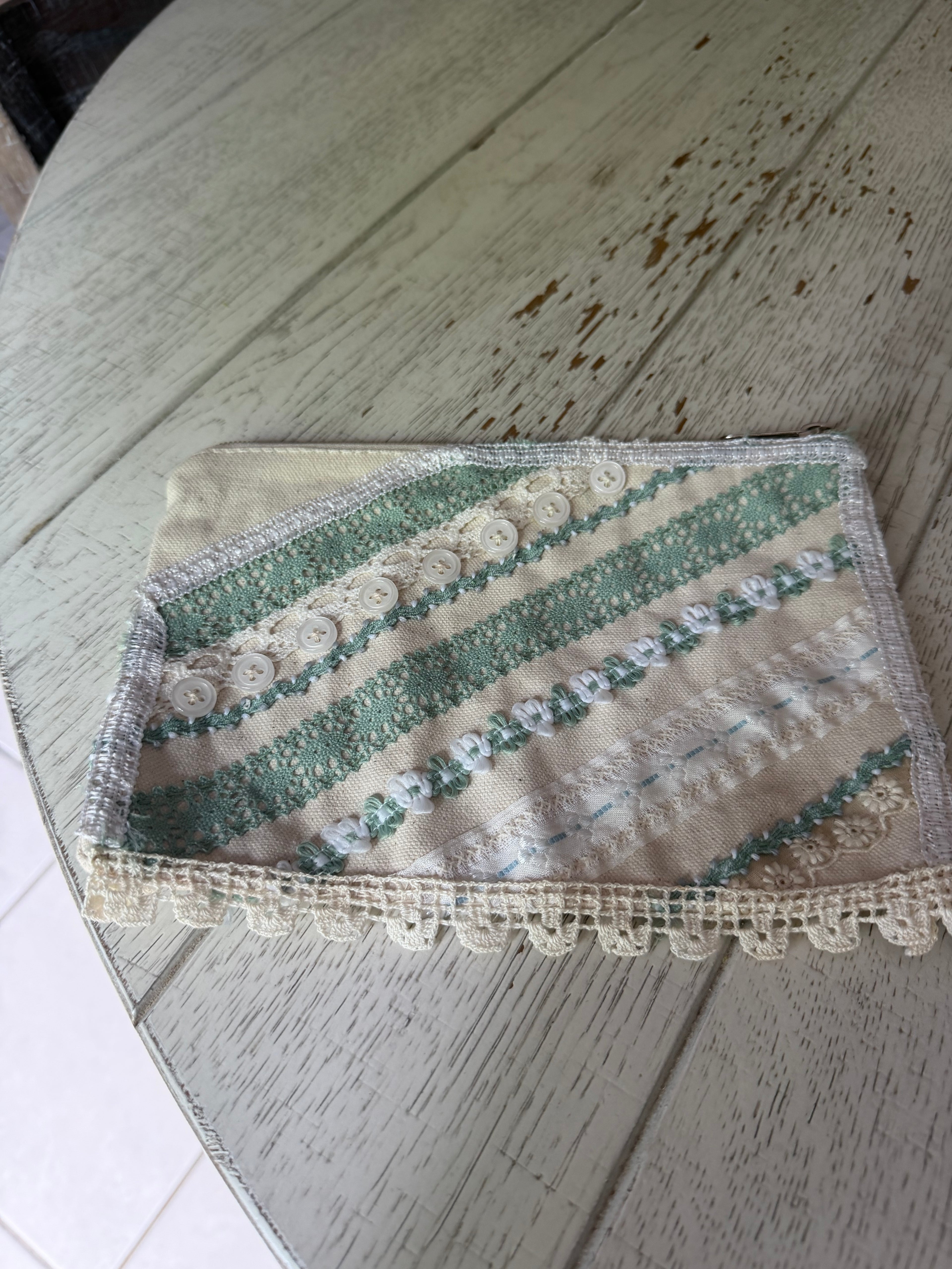 Medium cosmetic bag with hand sewn doily decor