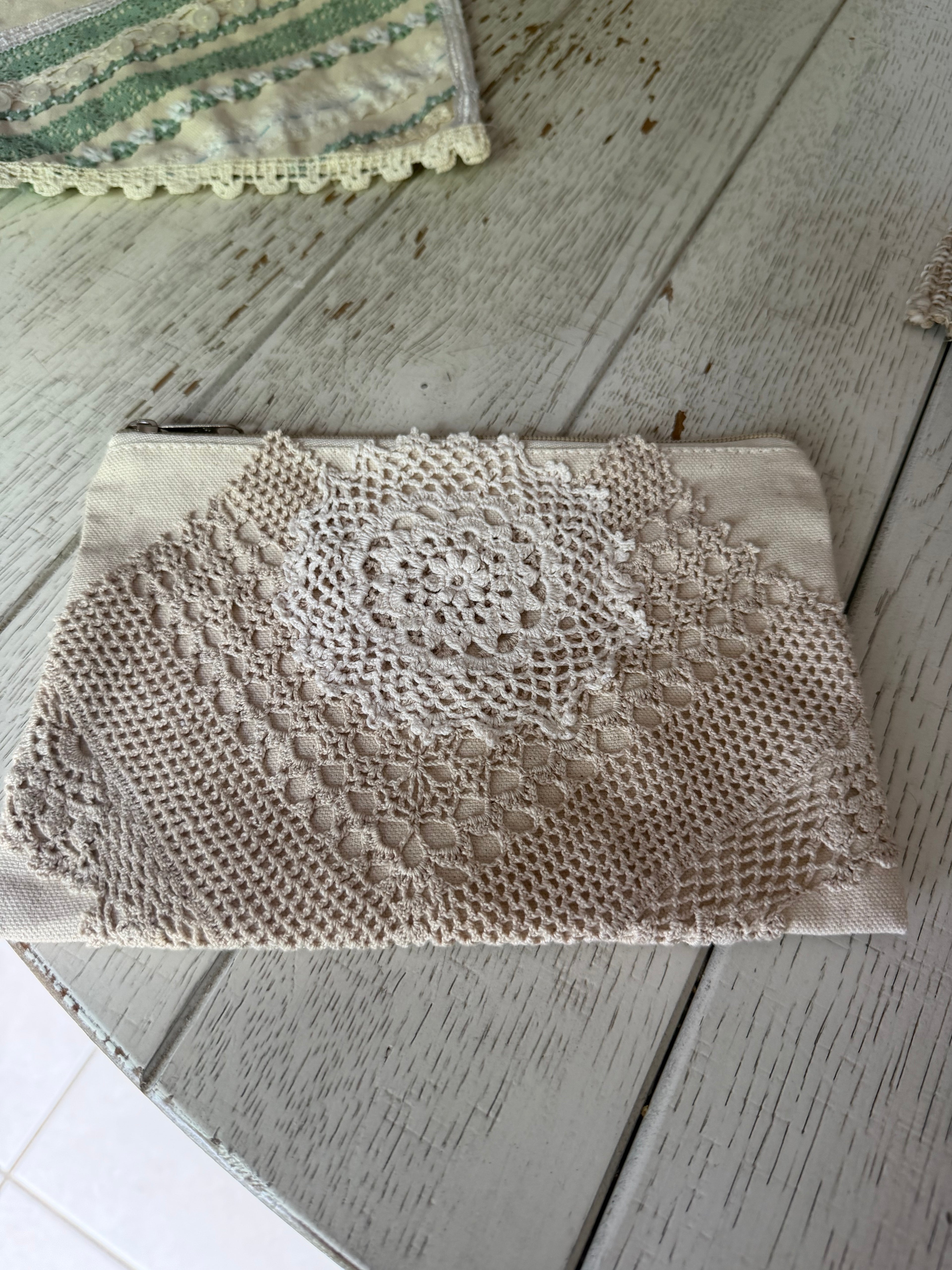 Medium cosmetic bag with hand sewn doily decor