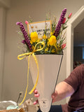 white enamel spring arrangement with crocheted flowers