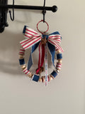 Handcrafted Patriotic Wooden Bead Wreath - red wire hanger