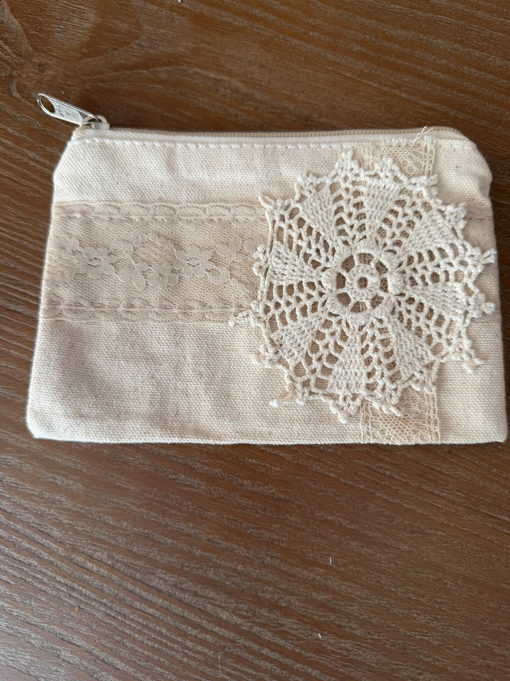 Small cosmetic bag with hand sewn doily decor both sides
