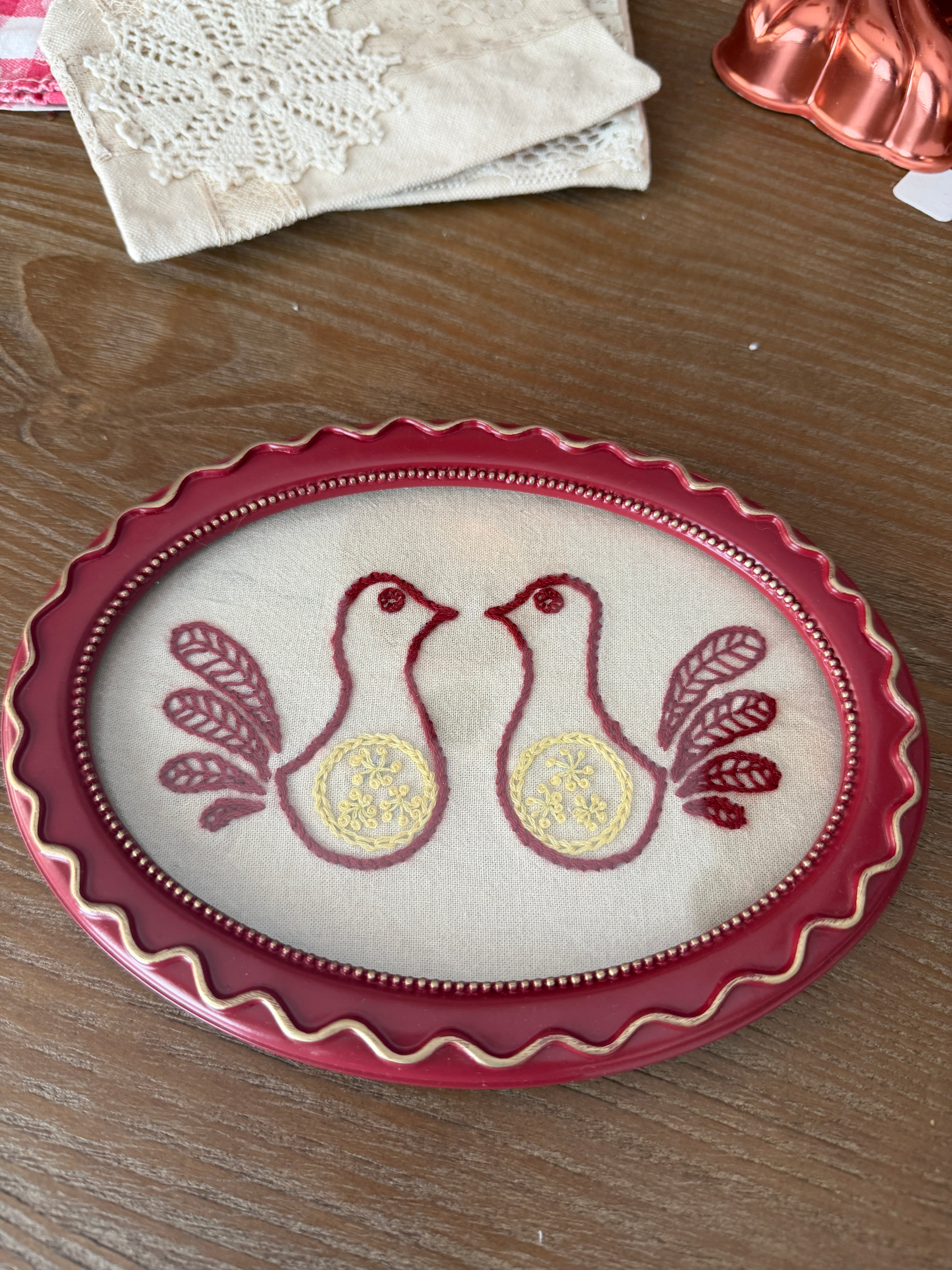 Hand-Embroidered Folk Doves in Cranberry Oval Frame