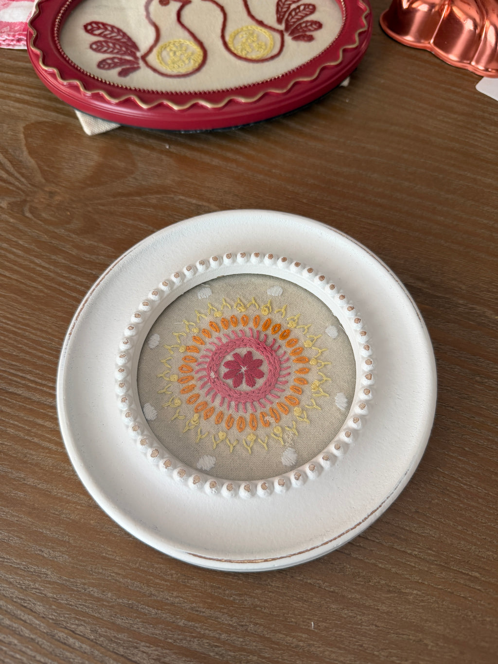 Embroidered mandala design - in round, white frame