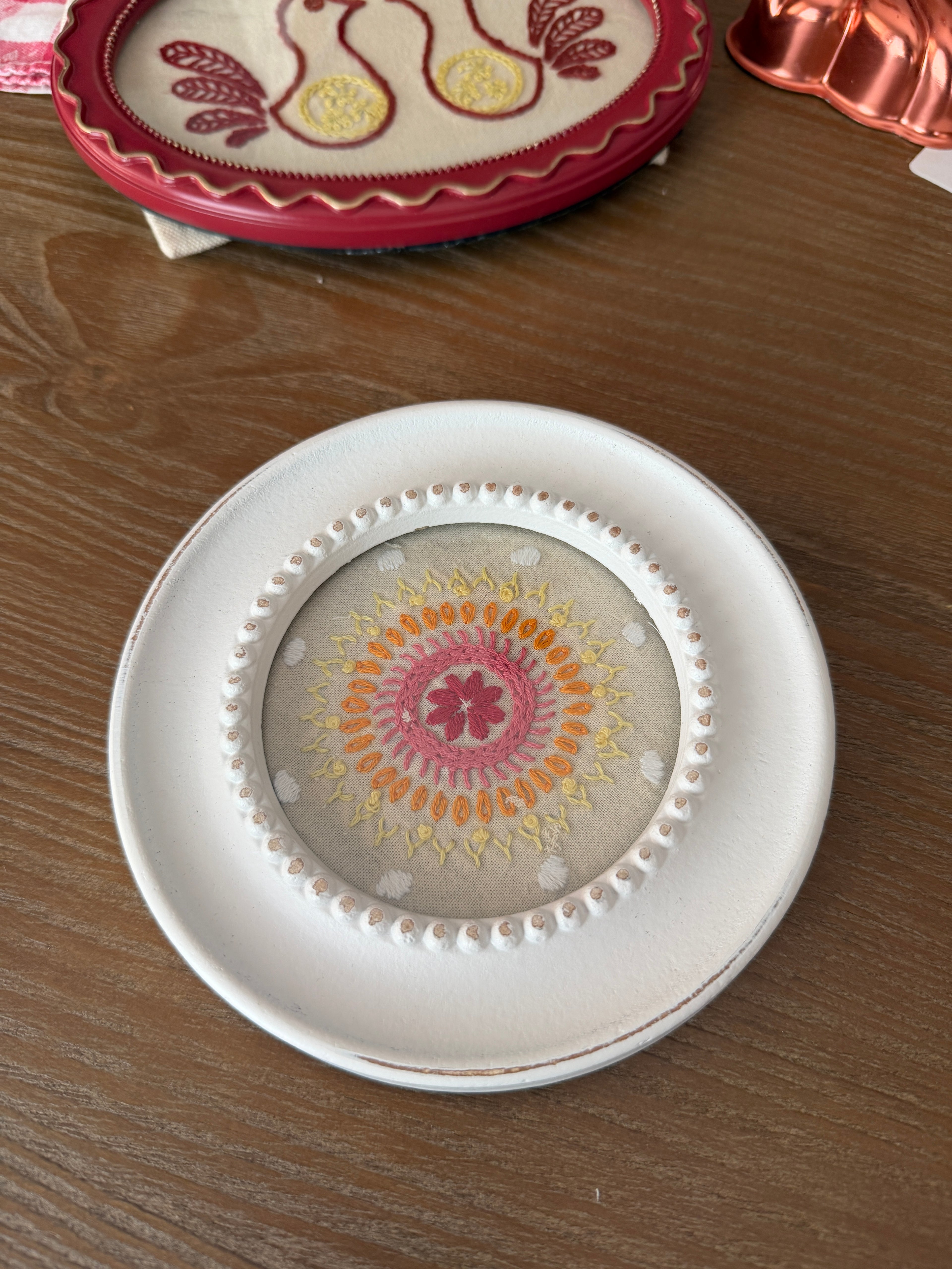 Embroidered mandala design - in round, white frame