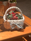 White braided basket with fabric strawberries