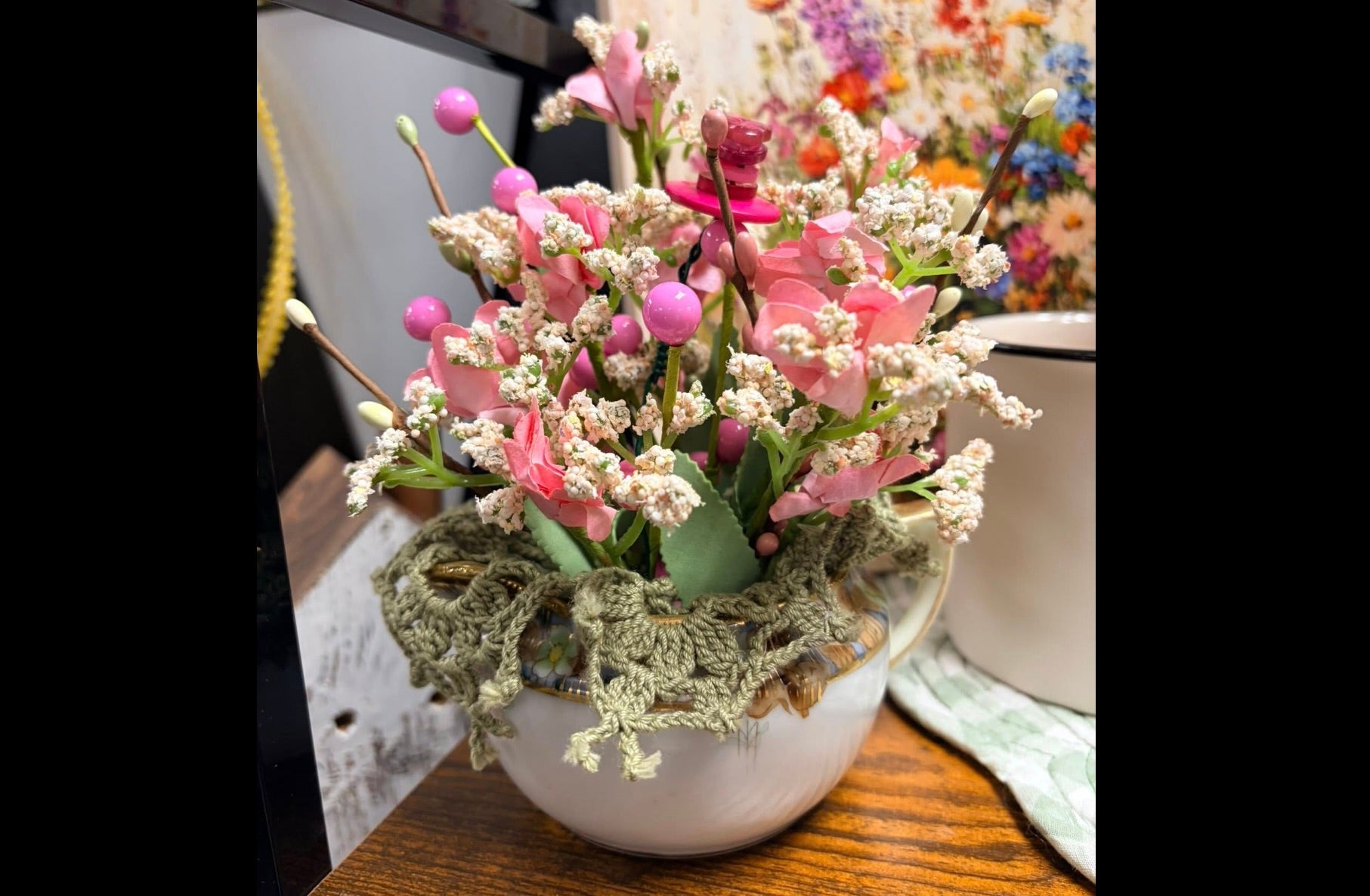 Pink flowers in white/gold creamer arrangement - green doily