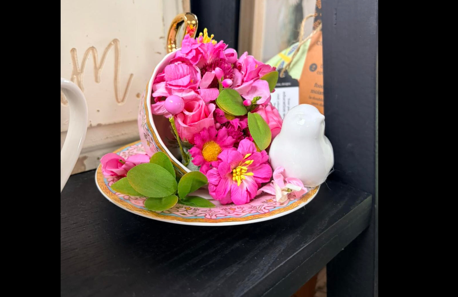 Pink teacup/saucer arrangement with white bird